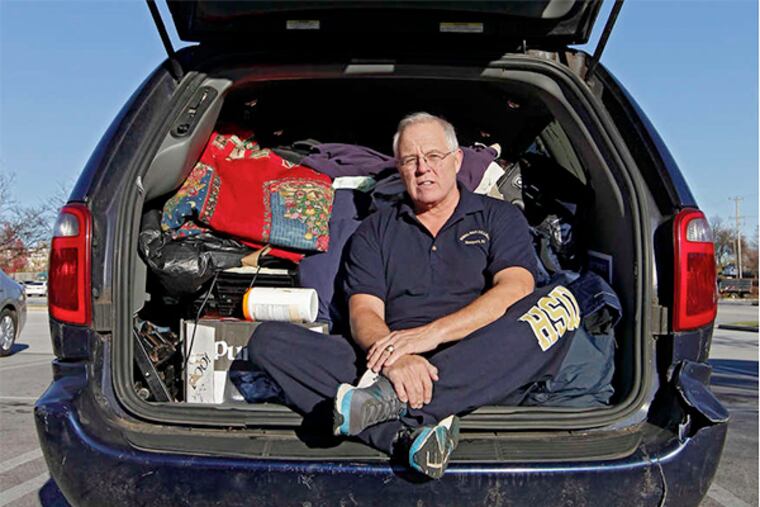 Robert Freniere in the van where he lives. "He's done a lot of things. . . . He's got the gift of gab. Very smart," said Adm. James Hogg, who officiated at Freniere's retirement.