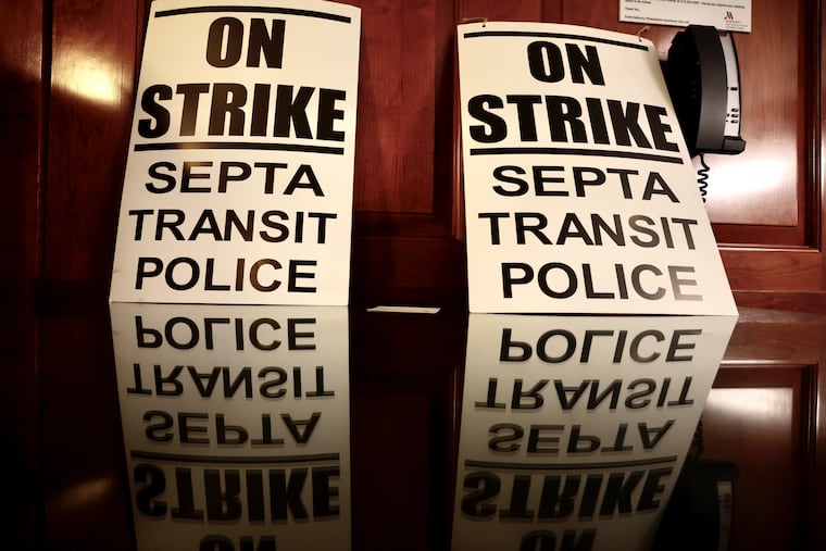 Strike signs at a news conference announcing that SEPTA transit police are on strike in Philadelphia on Wednesday, Dec. 13, 2023.