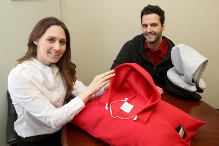 Rebecca Rescate found success before with her toilet-training kit for cats, and now she is helping Chris Hindley with his invention that may help buyers sleep through noise and other distractions. (Charles Fox / Staff Photographer)