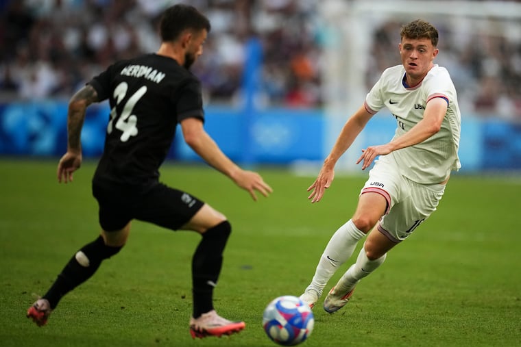 Jack McGlynn (right) playing for the United States at the Olympics.