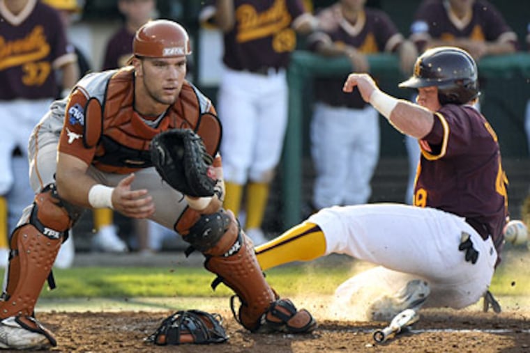Texas catcher Cameron Rupp, left, was selected in the third round of the baseball draft by the Phillies. (AP Photo/Ted Kirk)