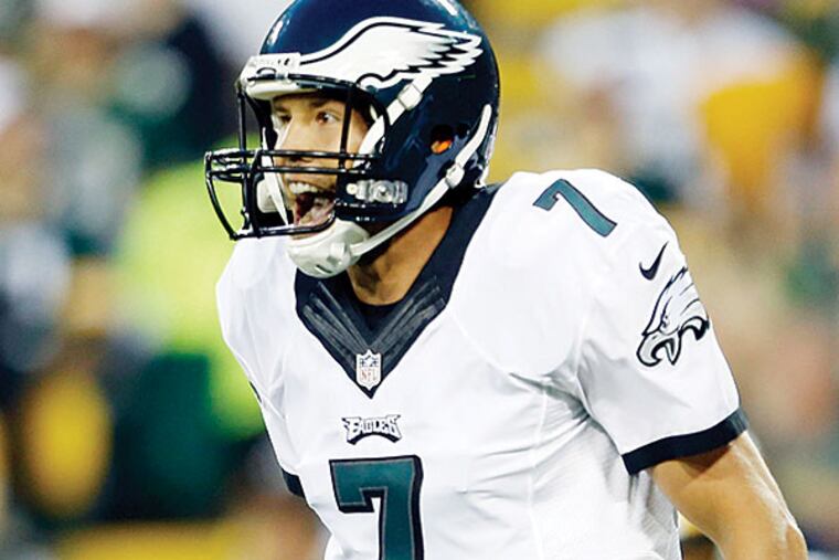 Eagles' Sam Bradford yells after throwing a first-quarter touchdown to Darren Sproles against the Green Bay Packers in a preseason game on Saturday, August 29, 2015 in Green Bay, WI.