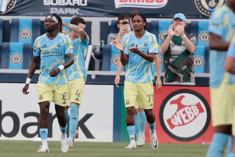 Eddy Davis (right) celebrates after providing the assist on the Union's second goal against Eintracht Frankfurt.