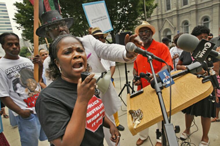 Yolanda Dyches, whose nephew was one of three men seen in a video last year being beaten by police, complains at the demonstration about a grand-jury report that cleared the officers. (Alejandro A. Alvarez / Staff Photographer)