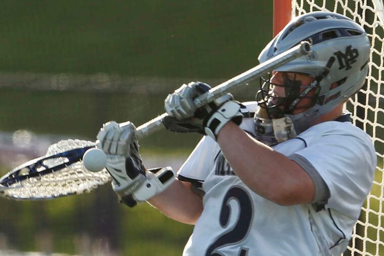 Malvern Prep goalie Matt Barrett makes a save against Episcopal Academy. Barrett turned away 14 shots in the Friars' 11-5 victory.