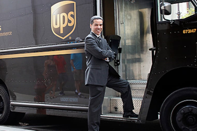 Carlos Vega is a homicide prosecutor by day and UPS supervisor by night. The veteran lawyer has been working two jobs for the past 14 years to put his kids through school. (Yong Kim/Staff)