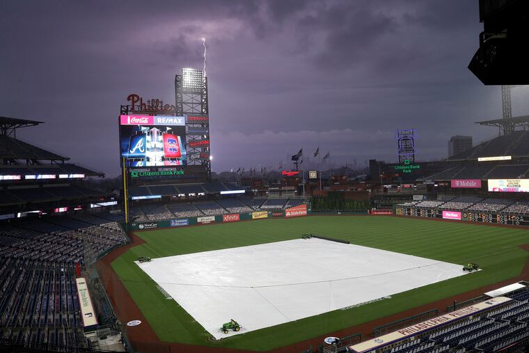 Lightning strikes over Citizens Bank Park in South Philadelphia before the Phillies were set to play the Atlanta Braves on Friday. The game was later postponed.