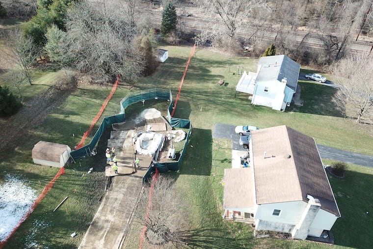 Repair crews fill sinkholes on March 3, 2018 that developed under Sunoco Pipeline's Mariner East 1 route near Lisa Drive in West Whiteland Township, Chester County.