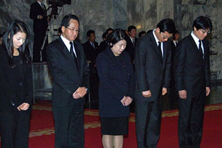 Members of the South Korean mourners group including Chairwoman of Hyundai Group Hyun Jeong-eun, center, pay their respects over the body of the late North Korean leader Kim Jong Il at Kumsusan Memorial Palace in Pyongyang, North Korea, Monday, Dec. 26, 2011. (AP Photo)
