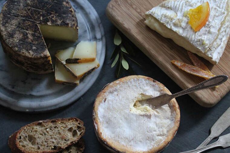 Grand Marnier Coupe (top R), Rush Creek Reserve, and Tomme Brulée pair well together on a holiday cheese board.