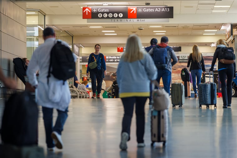 Travelers at Philadelphia International Airport on Wednesday, April 15, 2026.