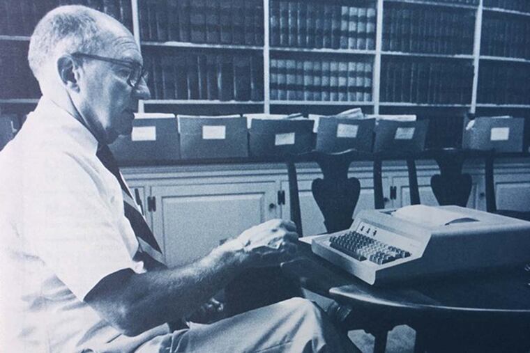 Raymond Millar Seidel using a typewriter with modem.