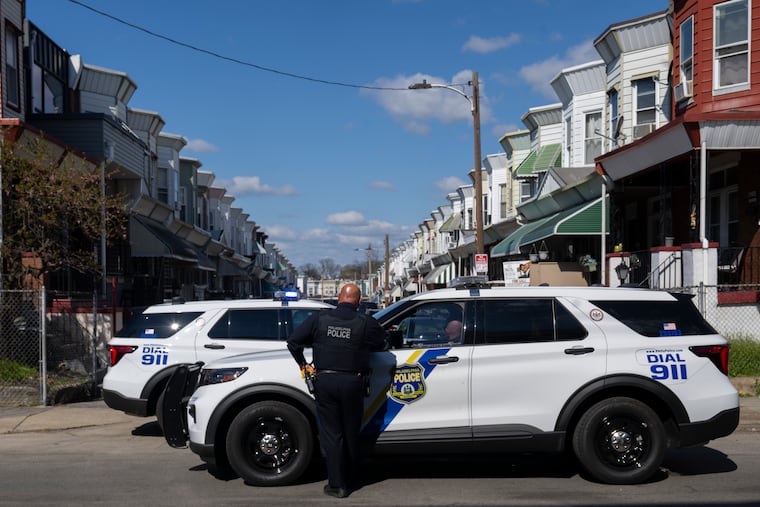 Police near the scene in West Philadelphia where Officer Laura Pelczar fatally shot a 75-year-old man who was armed with a gun on April 7, 2026.