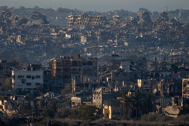 Destroyed buildings are seen inside the Gaza Strip, from southern Israel, on Monday, Jan. 13, 2025.