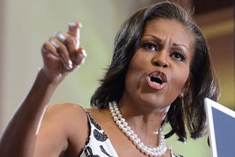 First Lady Michelle Obama makes a point to the crowd in the Bobby Morgan Arena on the University of the Sciences campus in West Philadelphia on Thursday. (Clem Murray / Staff Photographer)
