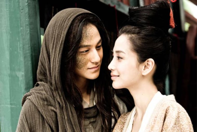 Help us, Dee: In "Young Detective Dee: Rise of the Sea Dragon," Kim Bum (left) and Angelababy are menaced by the titular monster.