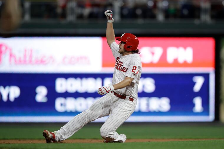 Philadelphia Phillies' Aaron Nola slide in to second after hitting a double off of New York Mets starting pitcher Zack Wheeler during the third inning of a baseball game, Friday, Aug. 30, 2019, in Philadelphia. (AP Photo/Matt Rourke)