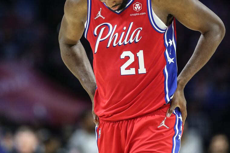 Sixers Joel Embiid walks back during a foul shot against the Nuggets during late in the 4th quarter at the Wells Fargo Center. The Nuggets beat the Sixers 113-110.