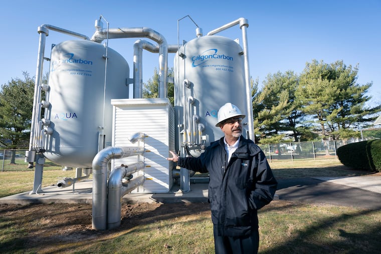 Marc Lucca, president of Aqua Pennsylvania, in front of the new Granular Activated Carbon Pressure Vessels at the company's New Britain, Bucks County, plant, in 2023. The vessels remove a class of chemicals known as PFAS. Aqua Pennsylvania filed suit March 3, 2025, against Arkema Inc., saying the chemical manufacturer contaminated waterways with PFAS used to serve customers drinking water in Delaware and Chester Counties.