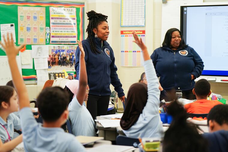 Takia McClendon, left, in her classroom with Principal Aliya Catanch-Bradley, right, at Bethune Elementary School, in Philadelphia in February. The state House approved a bill Monday that would increase state funding to the School District of Philadelphia.