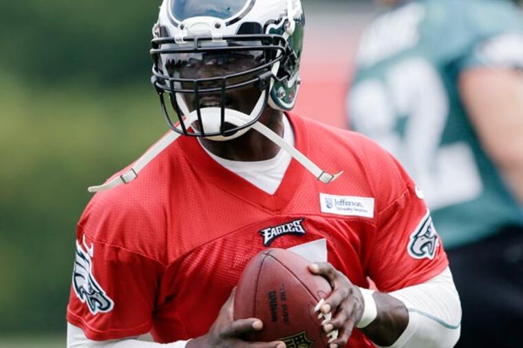 Michael Vick runs a drill at NFL football training camp in Philadelphia, Tuesday, July 23, 2013. (Matt Rourke/AP)
