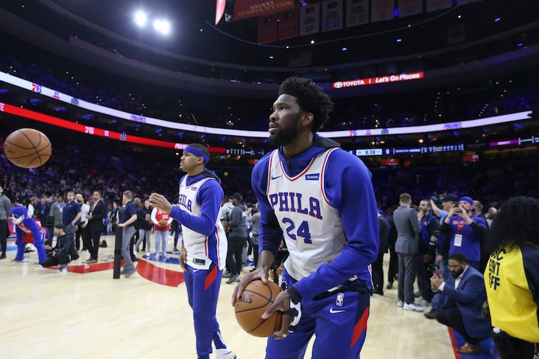 Joel Embiid and the Sixers warming up in jerseys with Kobe Bryant's number on them before they played the Golden State Warriors on Jan. 28, 2020 at the Wells Fargo Center.