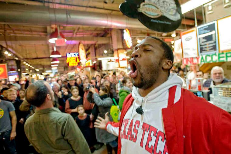 The Opera Company of Philadelphia's instant performances, here featuring Troy Cook (left)and Norman Garrett at Reading Terminal Market, are benign flash phenomena.
