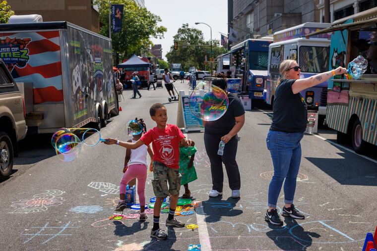 Amare Brown, 7, playing with bubbles at a Juneteenth celebration outside the African American Museum in Philadelphia on Monday.
