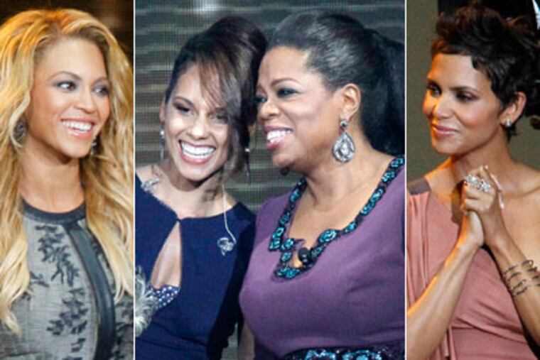 From left, Beyonce Knowles, Alicia Keys, Oprah Winfrey and Halle Berry. (AP Photo / Charles Rex Arbogast)