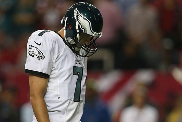 Eagles quarterback Sam Bradford puts his head down.