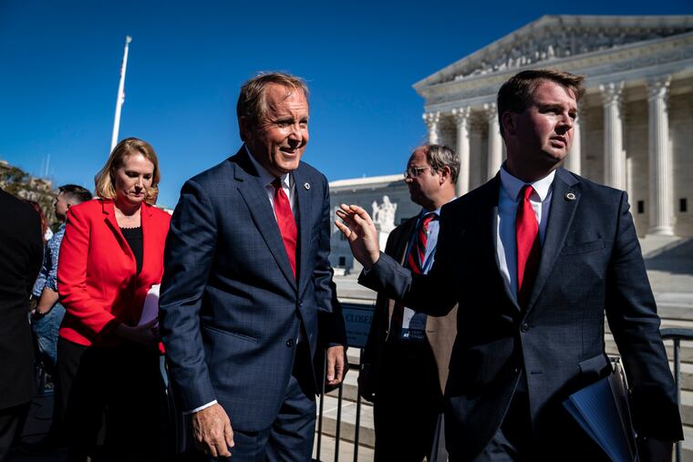 Texas Attorney General Ken Paxton, R, speaks outside the Supreme Court in November 2021 as arguments began over Texas's abortion law.