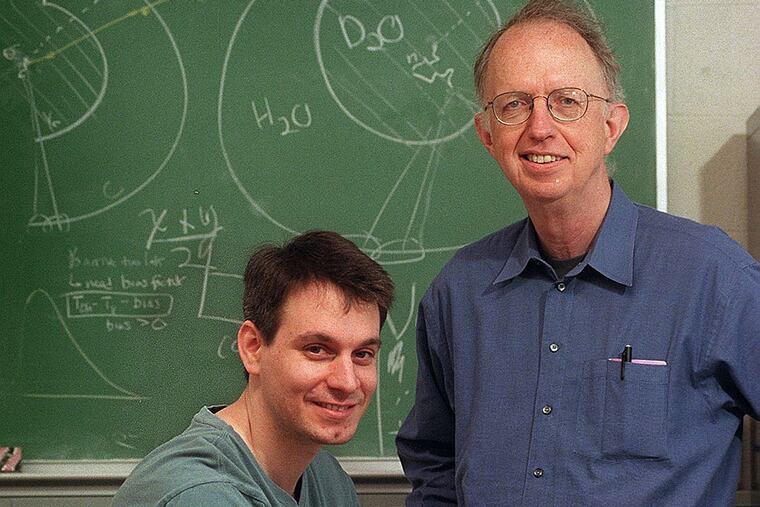 Researchers Josh Klein (left) and Gene Beier, in 2001, were among more than a dozen at Penn involved in the work. (JONATHAN WILSON/File Photo)