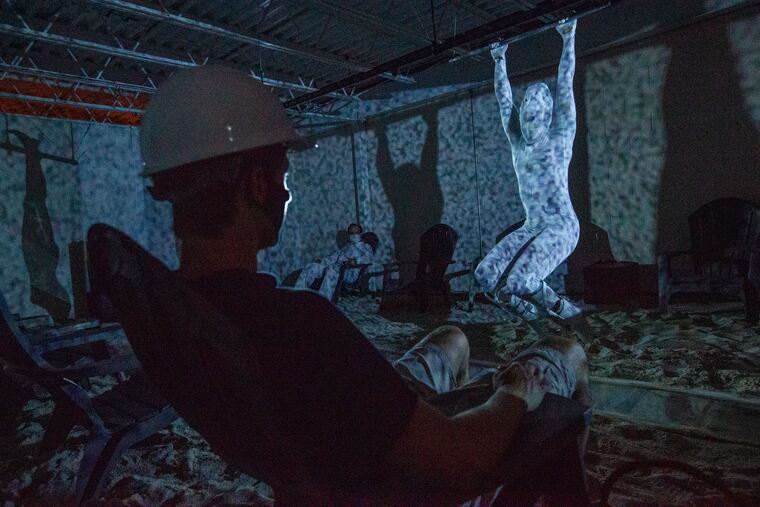 JUNK dancer Jess Adams hangs from the ceiling in Brian Sanders' new piece, "Dragonbutter."