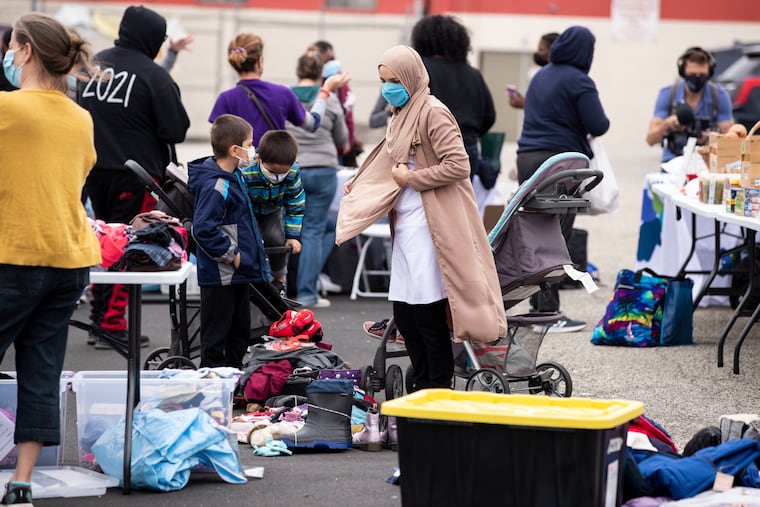 Immigrant and refugee families, including some from Afghanistan, picked up free clothing and healthy foods from the mobile social services program of the Jewish Family & Children’s Service of Greater Philadelphia at the Nationalities Service Center in Philadelphia, Pa. on Monday, October 11, 2021. Melanie London, JFCS director of marketing and communications, said that the clothing pop up shop and fresh produce can help fulfill the basic needs of refugee and immigrant groups from all over the world.