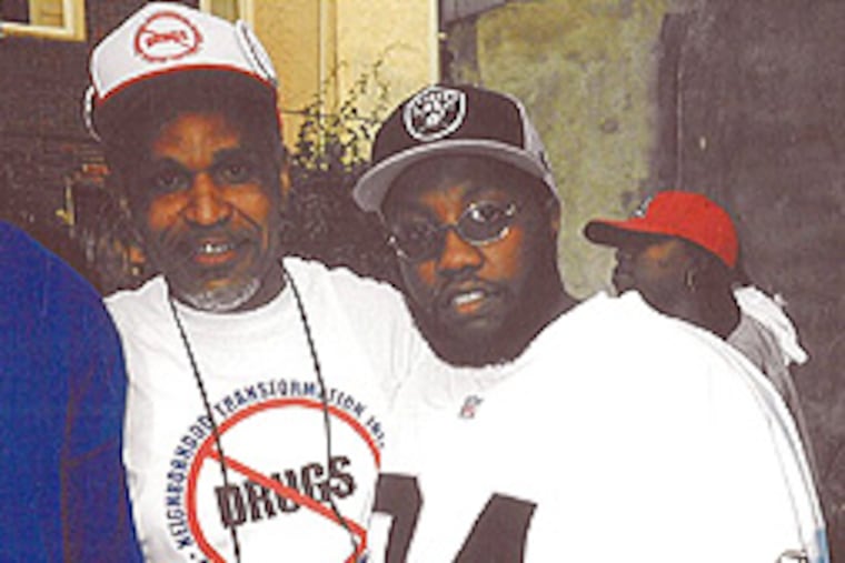 A photo submitted as evidence in the trial of Alton “Ace Capone” Coles shows codefendant Timothy “Tim Gotti” Baukman with then-Mayor John F. Street (right). The photo was taken at a community antidrug, stop-the-violence rally that was sponsored by Take Down Records, the Southwest Philadelphia record company that Coles and codefendant Timothy Baukman cofounded in 2002. No date on the photo was available.