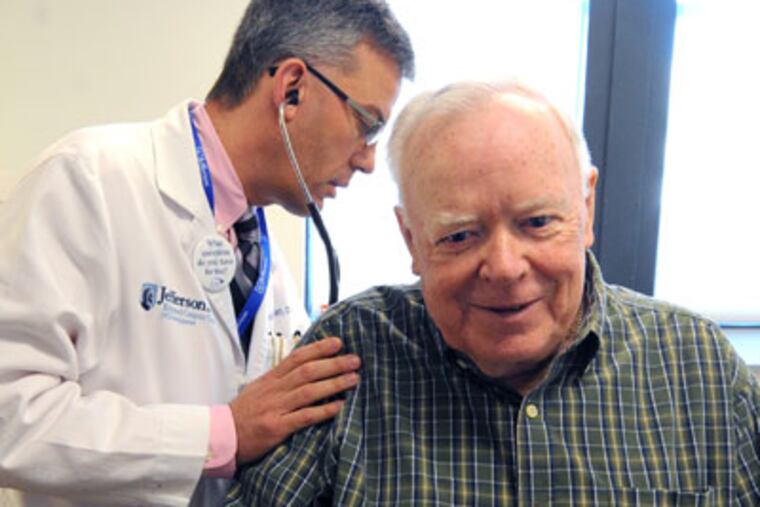 Bill Schooley, 72, West Deptford, has a physical exam by Oncologist Dr. Adnrew Chapman at Jefferson University Hospital. Schooley has multiple myeloma. ( Clem Murray / Staff Photographer )