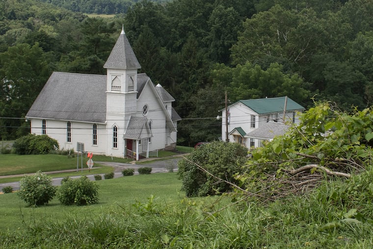 Bob Lemley, 75, a former mayor ( not shown ) of Blacksville, W.Va., stands near his property line, which he says is also the Mason-Dixon Line. Some of the community that residents refer to as Blacksville is actually in Wayne Township, Pa