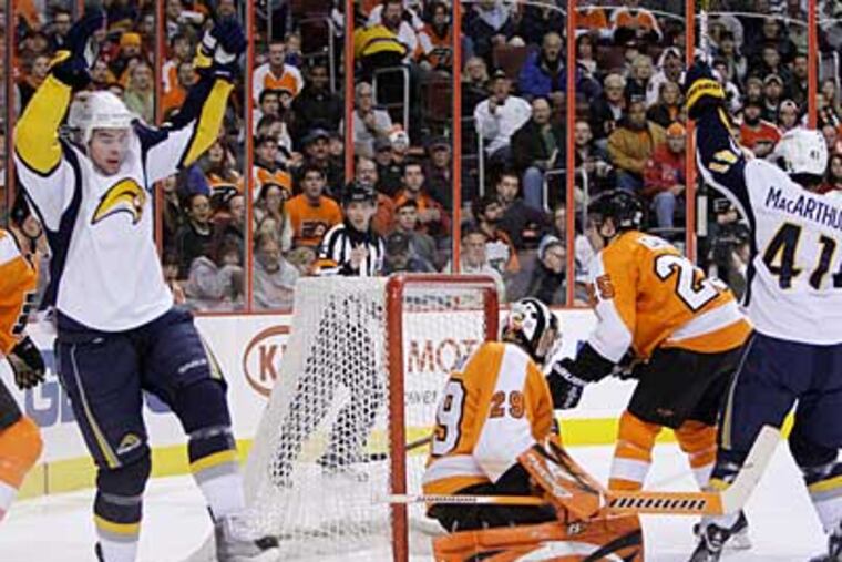 Buffalo Sabres' Drew Stafford (21) and Clarke MacArthur (41) celebrate after Stafford's goal against Ray Emery in the first period today at the Wachovia Center. (AP Photo/Matt Slocum)