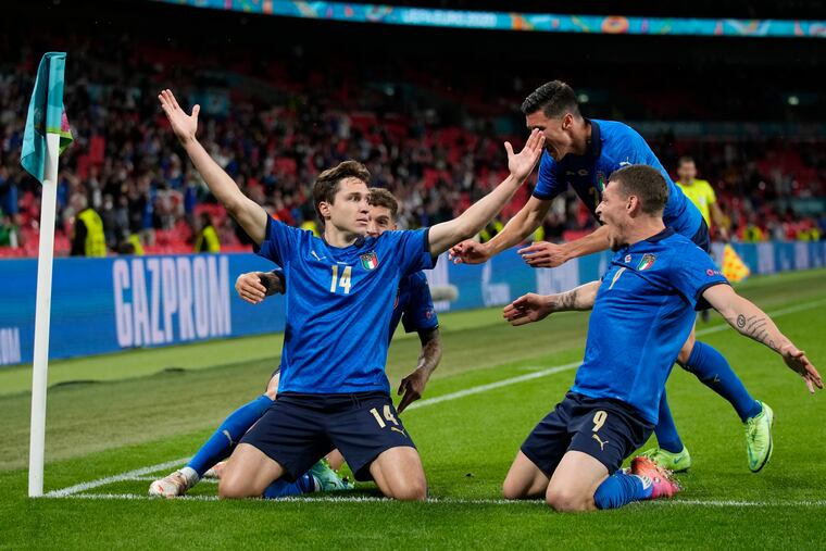 Italy's Federico Chiesa (left) celebrates with teammates after scoring his team's opening goal against Austria in the round of 16.