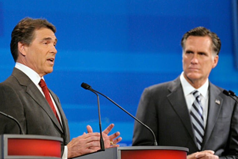 Texas Gov. Rick Perry (left) and former Massachusetts Gov. Mitt Romney squared off in the debate in Orlando, Fla. (AP Photo/Phelan M. Ebenhack, Pool)