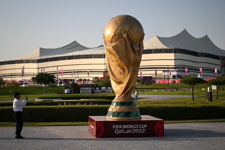 An oversized World Cup trophy outside the Al Bayt Stadium in Qatar, which will host the opening game of the men's World Cup.