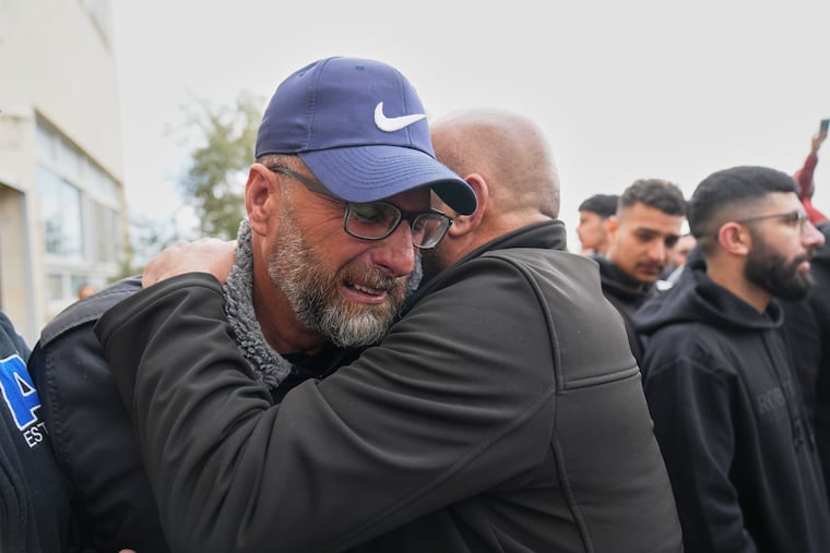 Mourners give condolences to Mohammad Abu Siyam, the father of Palestinian American Nasrallah Abu Siyam, 19, during his funeral Wednesday night in the West Bank village of Mukhmas, east of Ramallah.