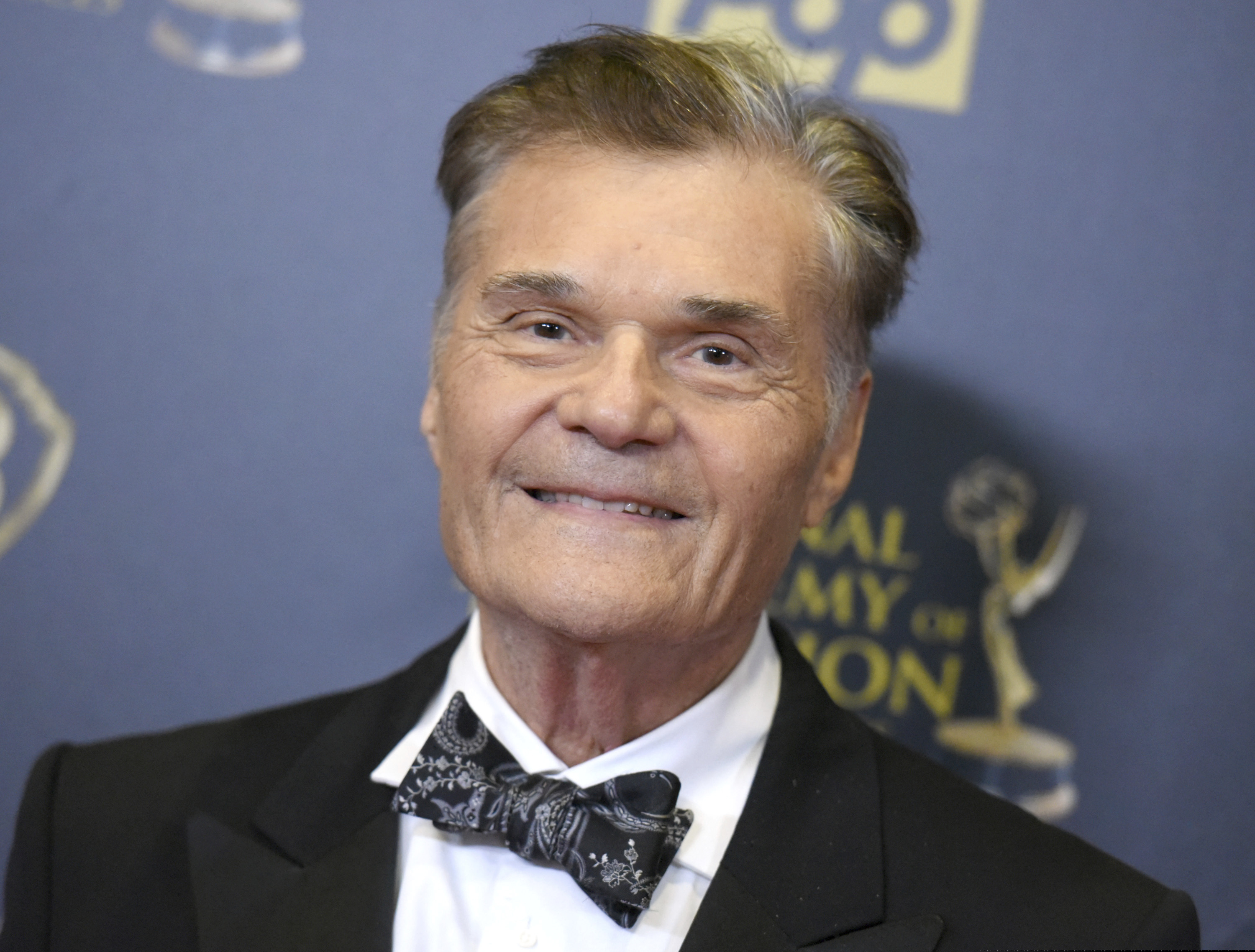 Fred Willard posing for a photo at the 2015 Daytime Emmy Awards.