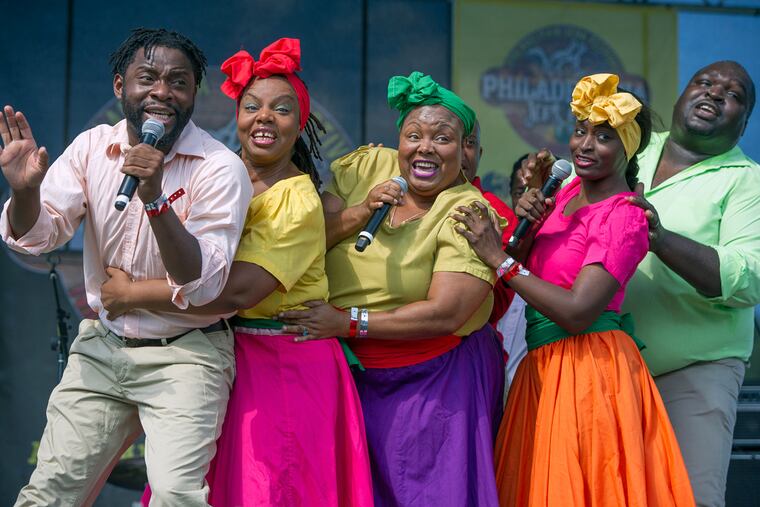 Members of the New York based Jamaican singing group the Braata Folk Singers perform for an enthusiastic audience at Philadelphia Jerkfest in Fairmount Park on Sunday, Aug. 28. From left are Andrew Clarke, Dianne Dixon, Vinette Matthews, Lori Minor, Camara Foster.