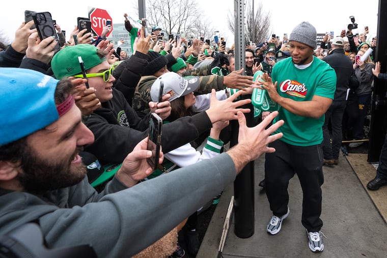 Super Bowl champion Saquon Barkley greets fans at Raising Cane's in Bucks Co. on Thursday.