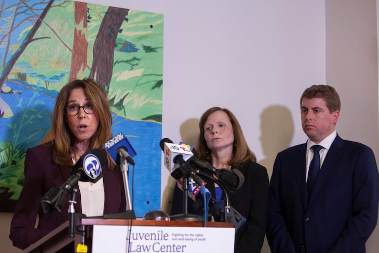 Marsha Levick (left), Chief Legal Officer of the Juvenile Law Center, speaks during a news conference, along with Maura McInerney (center) and Michael McGinley, regarding a lawsuit against Glen Mills Schools and Pa. officials, last week.