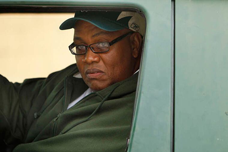 With his familiar green van, Raymond Gant works to clean up and turn around blighted areas of Kensington and Frankford. (David Maialetti/Staff)