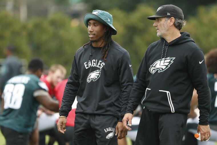 Ronald Darby (left) and defensive backs coach Cory Undlin (right) talks during Eagles training camp.