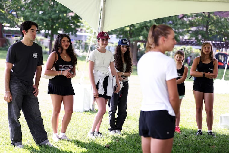 Radnor High School tennis team players spoke with Julia Grabher (right) at the Philly Open on Wednesday.