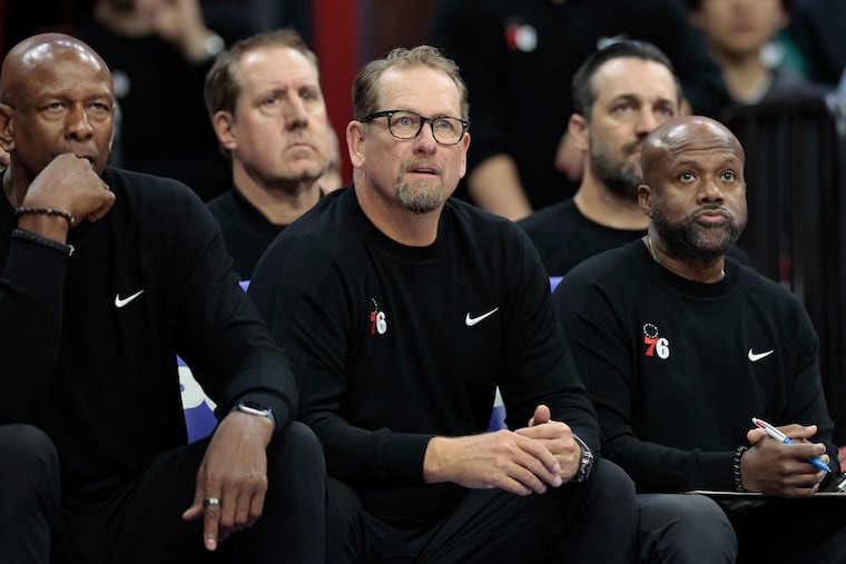 Sixers coach Nick Nurse (center) will begin his third season with the team on Wednesday night.